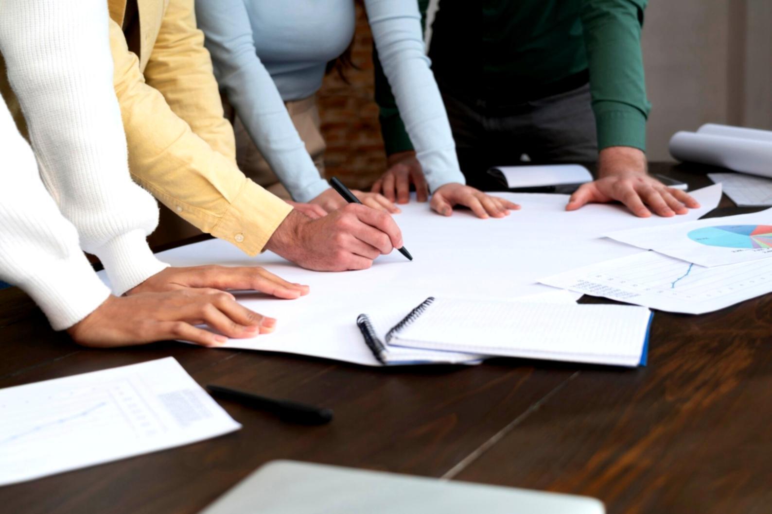Budget risk workshop discussion with financial documents